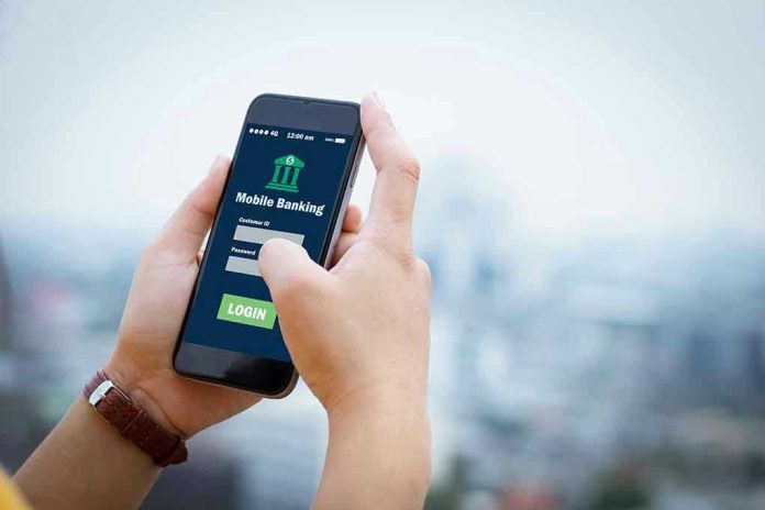 564088018 Person using mobile banking app on smartphone