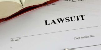 Lawsuit paperwork with pen and open book