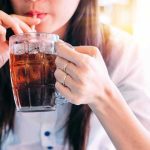 SNAP Reform Bombshell: Soda, Candy Off Limits Person drinking soda from a glass mug
