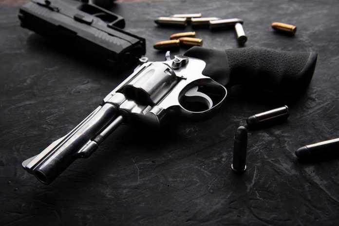 Revolvers and bullets on a dark surface
