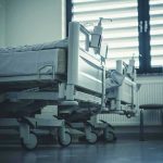 Empty hospital beds by a window