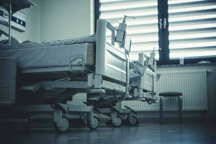 Empty hospital beds by a window