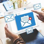 Tablet displaying email inbox with notifications icon