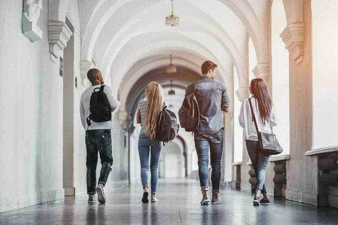 Four students walking in a corridor together