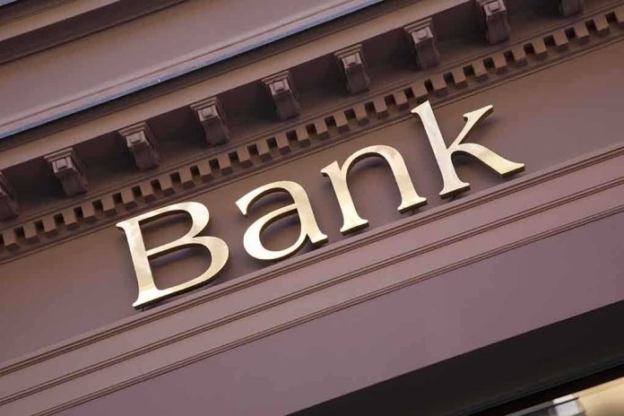 Close-up of a bank sign with gold lettering