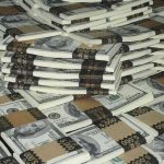 Piles of bundled cash stacked together