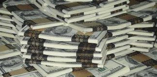 Piles of bundled cash stacked together