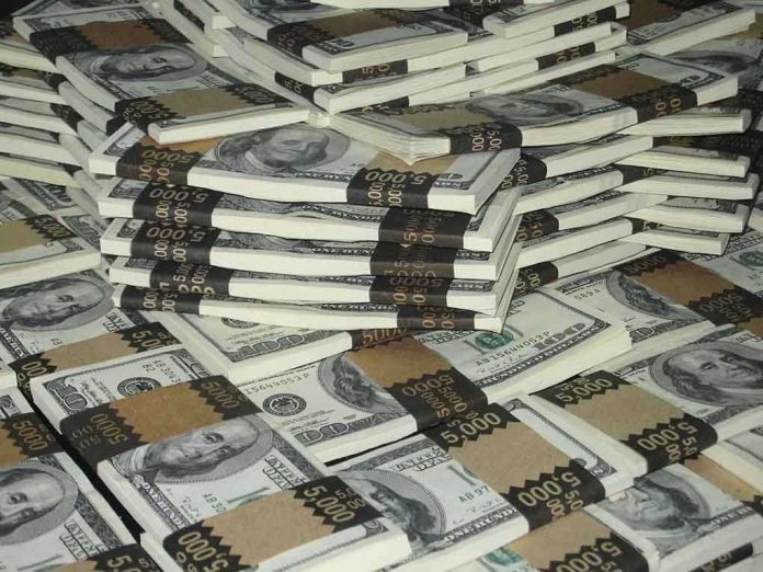 Piles of bundled cash stacked together