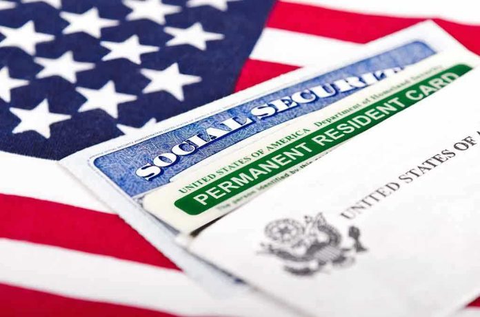 146169356 Social Security card and green card on flag.