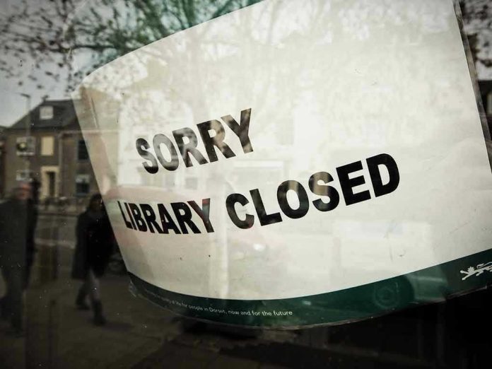 Sorry, library closed sign on window.
