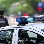 Bloody Night STUNS Pennsylvania—Police Forces Paralyzed Police car and officer on a city street.