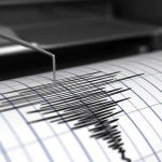 Scientists Sound Alarm: Quake Crisis Unfolds Seismograph needle recording earthquake activity on paper.