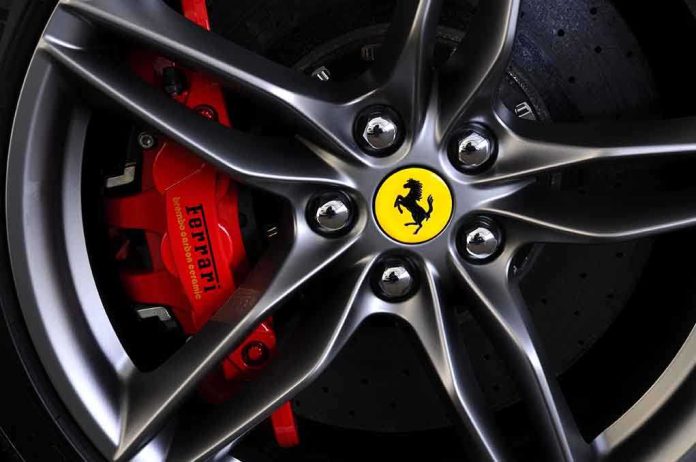 Close-up of a Ferrari wheel showcasing the brake caliper and logo