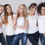 Skincare Giants PANIC Over New Technology Five women in white t-shirts and jeans smiling together