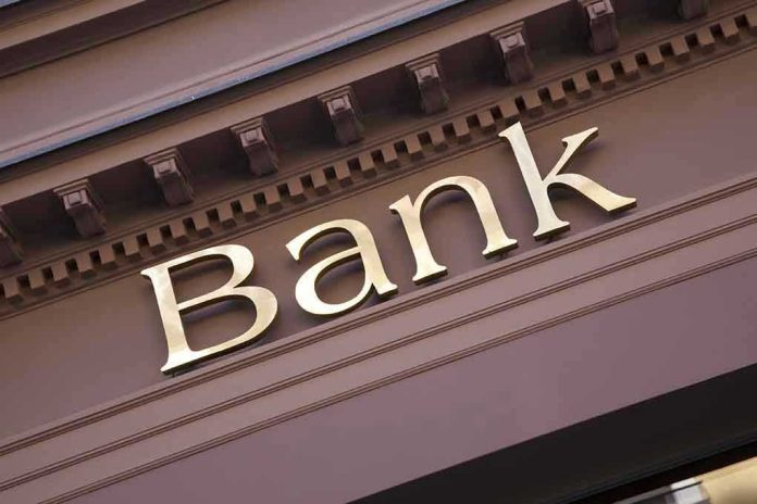Gold bank sign on building facade
