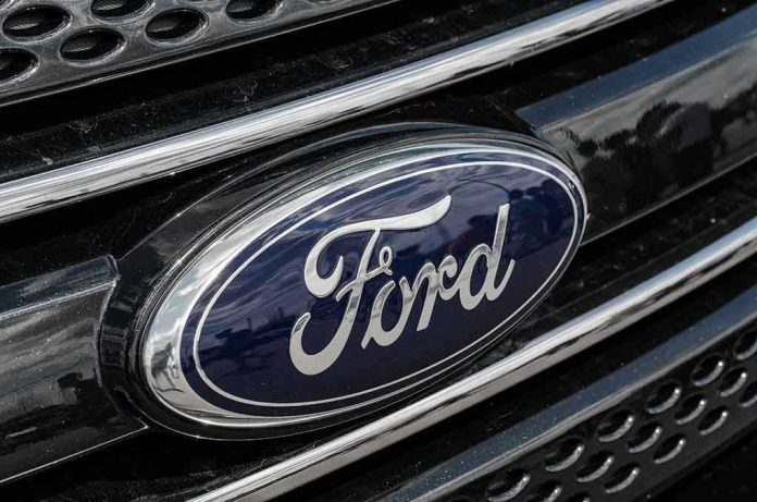 Ford logo on car grille close-up.