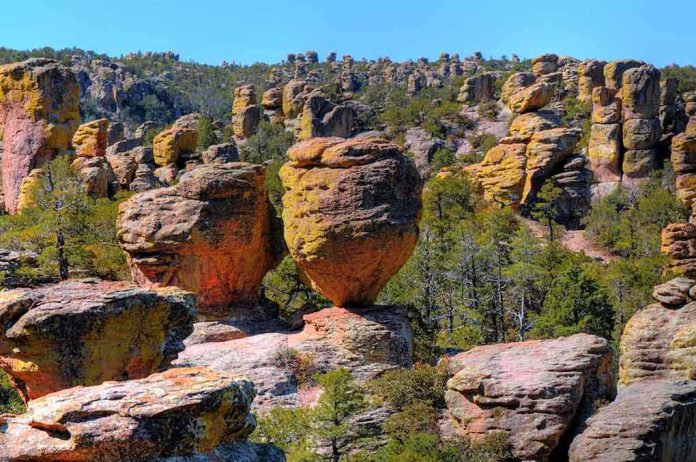 shutterstock_37134283.jpg Unique rock formations surrounded by greenery under a clear blue sky