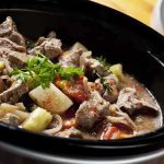 Unseen Gold in Your Kitchen Waste A hearty beef stew with vegetables in a slow cooker