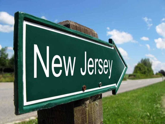 shutterstock_85658770.jpg Directional road sign indicating New Jersey