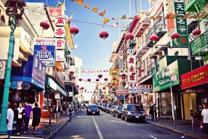 A bustling street in Chinatown adorned with colorful lanterns and signs