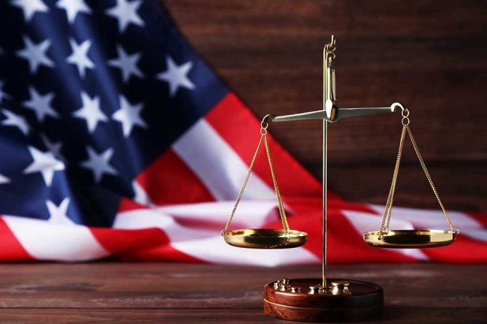 Scales of justice with American flag background.