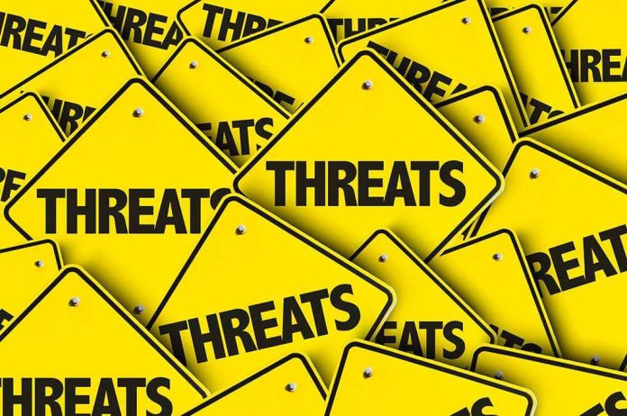 Yellow warning signs with the word THREATS.
