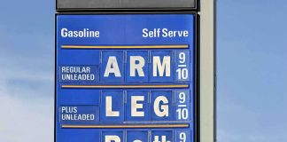 Gas station price sign displaying fuel prices