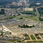 Trump Crushes Pentagon Resistance Aerial view of the Pentagon surrounded by highways and urban areas