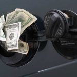 Cash sticking out of a cars gas tank