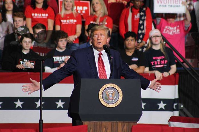 1662925921 Person speaking at podium with crowd behind them.
