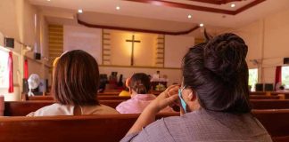 Bishop Blasts Islam: ‘Inherently Intolerant’ People sitting in church pews during service.