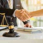 ABA SHOCK: DEI Rule SCRAPPED, Future Uncertain Hands shaking over legal documents with gavel and scales.