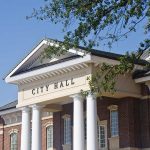 Obama Connection FAKE—Spencer Pratt Supporters Revealed Exterior view of a city hall building with columns and a clear blue sky