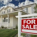 Dream Home Now a Fantasy for Most Americans A suburban house with a For Sale sign in the front yard
