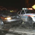 Did Government’s ICE Crash Story FALL APART? A damaged car and a police vehicle involved in a nighttime accident