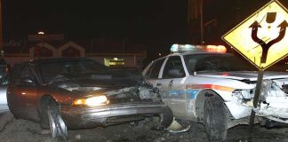 Did Government’s ICE Crash Story FALL APART? A damaged car and a police vehicle involved in a nighttime accident
