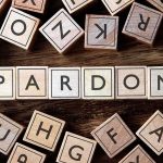 CIA Obstruction? Luna’s Explosive JFK Files Hunt Wooden letter blocks arranged to spell 'PARDON' on a wooden surface