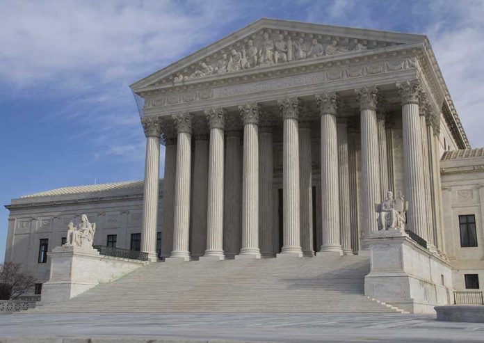 shutterstock_Eletric-car-1 The Supreme Court building featuring large columns and statues
