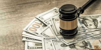 DNA Heist PAYOUT — Do YOU Qualify? Gavel on a pile of hundred-dollar bills.