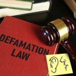 FIRE CHIEF Sues MAYOR — Who Lied About The Inferno? Defamation law book with gavel and illustration