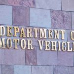 BIZARRE — DMV Glitch TRIGGERS a Federal Crime! Sign for the Department of Motor Vehicles on a stone wall