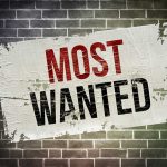 LETHAL Strike DROPS MOST WANTED Gang BOSS A weathered poster displaying the words MOST WANTED on a brick wall