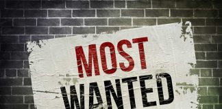 LETHAL Strike DROPS MOST WANTED Gang BOSS A weathered poster displaying the words MOST WANTED on a brick wall