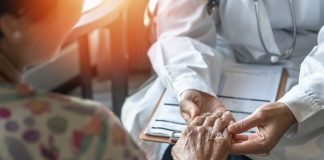 GRIM New York Move Sparks “Throwaway” FEARS A doctor holding the hand of an elderly patient during a consultation