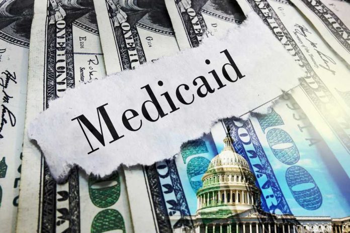 shutterstock_2599292677 Medicaid text over cash and capitol building