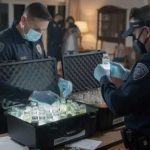 FBI agents examining evidence in a home setting