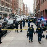 FBI agents conducting an operation at a city street crime scene