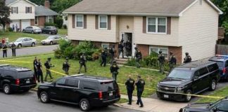 U.S. Citizens NABBED for TREASON — ISIS Shocker! Law enforcement officers conducting a raid in a residential neighborhood