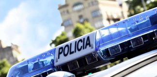 Masked Commandos Snatch Journalist FROM HER HOME Close-up of a police cars light bar with the word POLICIA