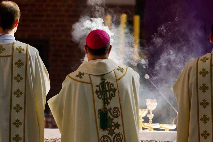 Bishop-censes-incense_1373336762 Clergy in ornate vestments during a church service with incense smoke